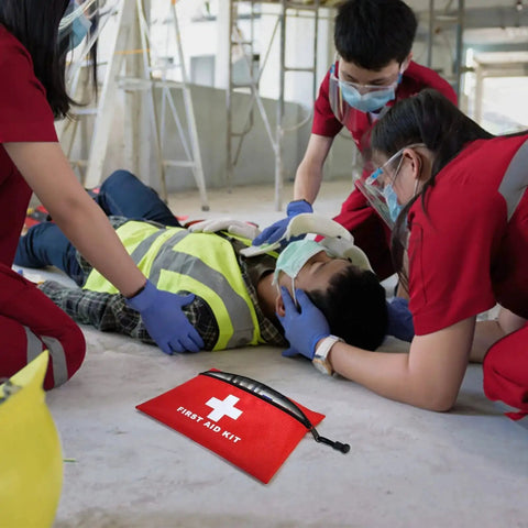 Portable Empty First Aid Kit Pouch With Zippered Opening used by medics in an emergency scene, showcasing its practicality for emergency use.