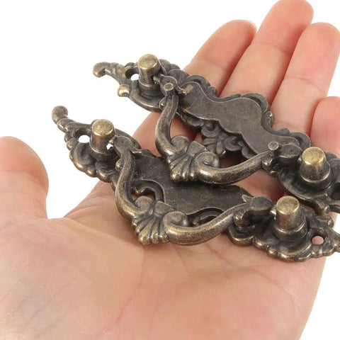 Hand holding Vintage Cabinet Handles 4.33 Inch Antique Brass Drawer Pulls Decorative Dresser Hardware