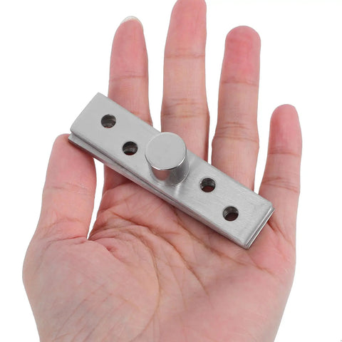 Invisible Pivot Hinges For Hidden Doors And Cabinets, 360 Degree Stainless Steel Concealed Center Hinges shown in a hand for size reference.