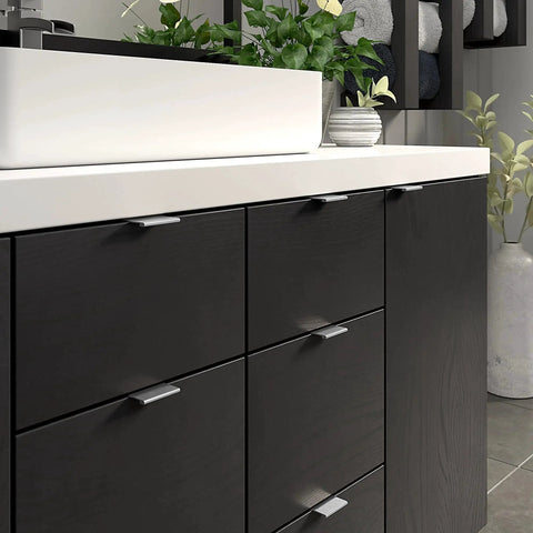 Lincoln Collection 1 5 16 Inch Center To Center Stainless Steel Modern Cabinet And Drawer Edge Pull Handle installed on dark cabinet.