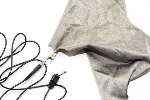 20 ft grounding cable with alligator clip and two-prong plug beside silver EMF shielding fabric.