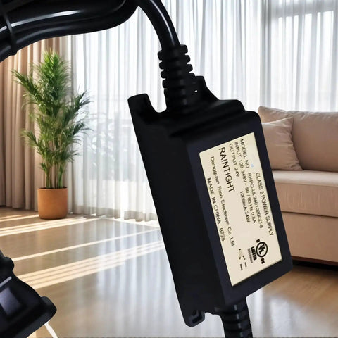 Close-up of 24V DC 1A LED Power Supply, 24W Constant-Voltage Transformer, Black, in indoor setting, showing IP67 waterproof label.
