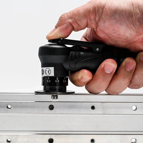 Hand using Slick 45 Degree Mini Chamfering Tool for Metal and Wood Deburring and Beveling, portable pneumatic handheld trimming edge tool.