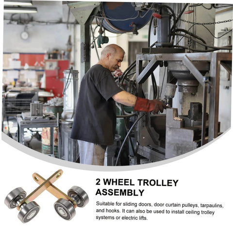 2 wheel trolley assembly with double bearings and galvanized iron material for sliding doors visible in workshop setting.