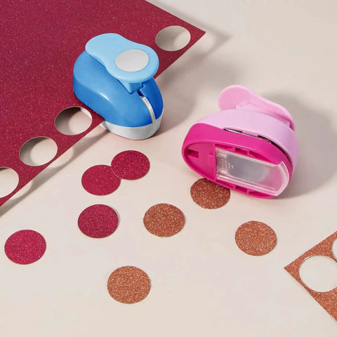 Pink and blue circle punches from the Six Size Circle Punch Set For Paper Crafts With Easy Operation And Color Vibes on glitter paper