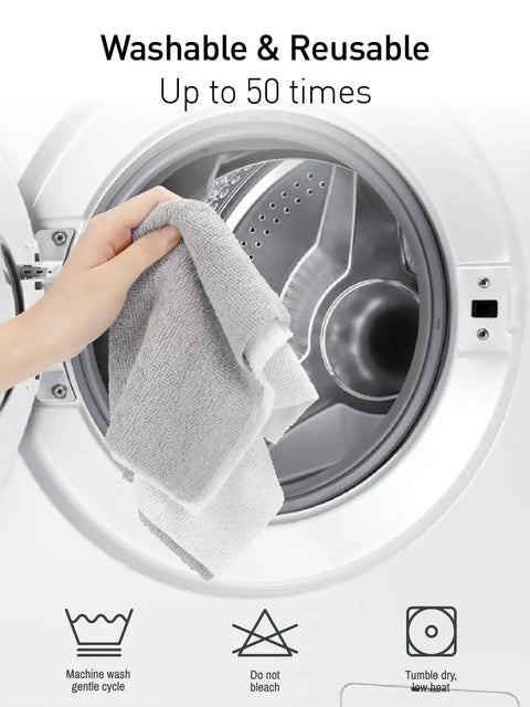 Hand placing 12x12 Inch Tear Away Microfiber Cloth Roll 40 Pack Reusable Washable Towels into a washing machine