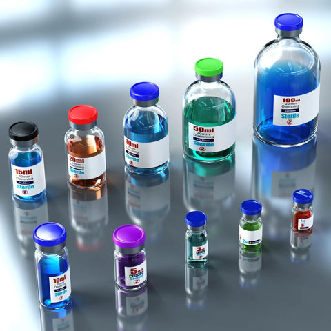 Ks-Tek sterile empty vials with flip-off aluminum caps in assorted sizes on a reflective lab surface
