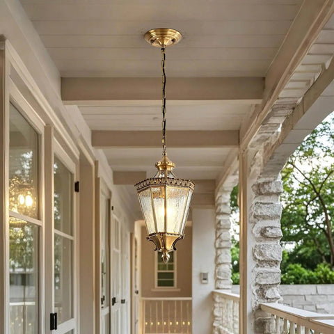 Copper Outdoor Pendant Light With Waterproof Anti Rust Finish installed on a porch ceiling, brass exterior hanging fixture