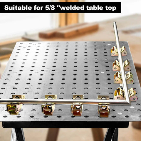 Magnetic V Block Fixture Pin for welding tables with adjustable pipe holder clamp securing round tubes on a perforated table.