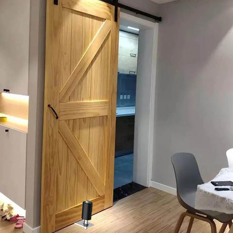 Barn door with Two Pack 3-Inch Sliding Gate Rollers With Adjustable Guide Bracket, black finish, installed in modern interior