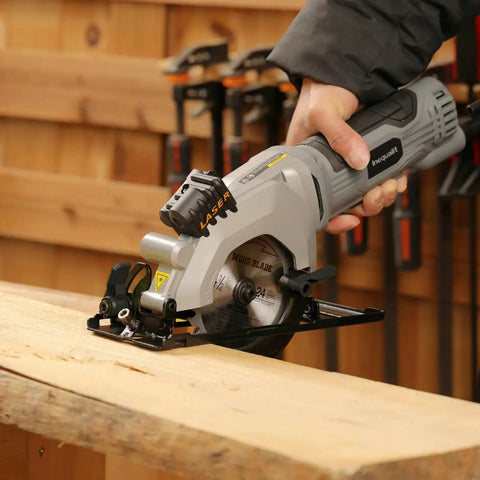 Person using Powerful Corded Four Amp Circular Saw With Laser Guide And Bevel Cuts, 3500 RPM, Four And A Half Inch 24T TCT Blades