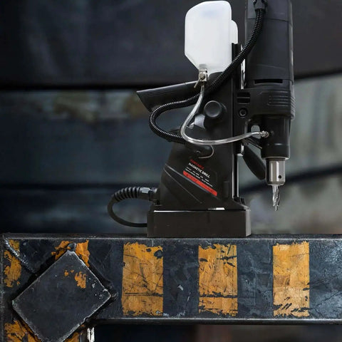 Side view of Magnetic Drill Press Kit 1100W Portable, 700 RPM No Load, 2 Inch Depth of Cut drilling steel surface.