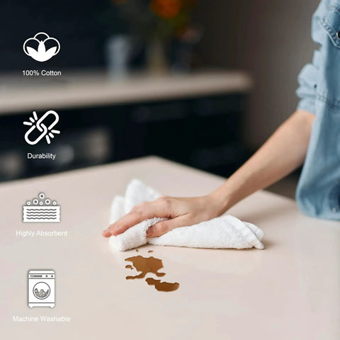 Person using Pack Of 50 White 12 By 12 Inch Cotton Terry Cleaning Cloths For Auto Detailing, Painters, And General Cleaning on countertop