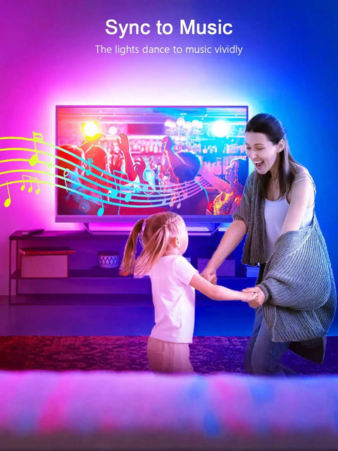 16.4ft RGB TV Backlight Strip USB Powered Bluetooth App Control And Remote creating ambient lighting during family dance