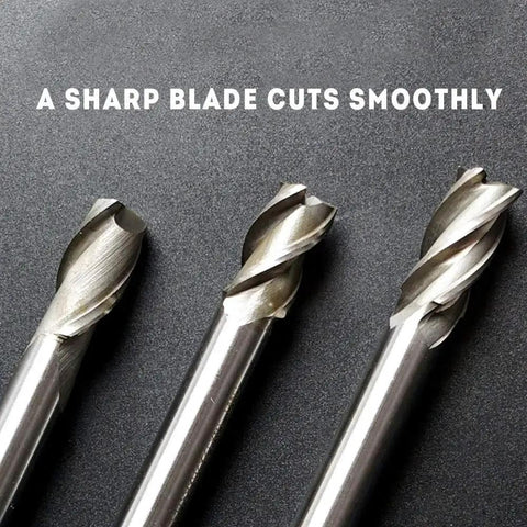 Close-up view of three cutting bits from the 8 Piece HSS CNC End Mill Bit Set With Straight 4 Flute Cutters For Wood Aluminum Steel Titanium