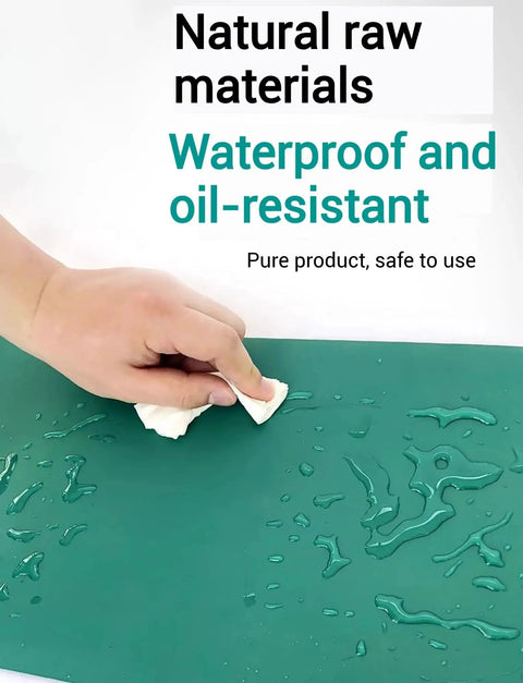 Hand wiping water on 33 Ft Rubber ESD Soldering Mat Roll Anti Static Grounding Desk Mat, showcasing oil-resistant surface.