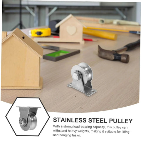 Stainless Steel Groove Wheel Pulley For Sliding Doors And Barn Doors with heavy-duty design on a table with tools.