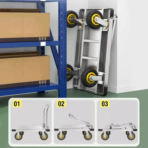 Heavy Duty Platform Truck With 2200 Lbs Capacity Foldable Moving Flatbed Cart stored vertically beside shelving in a garage