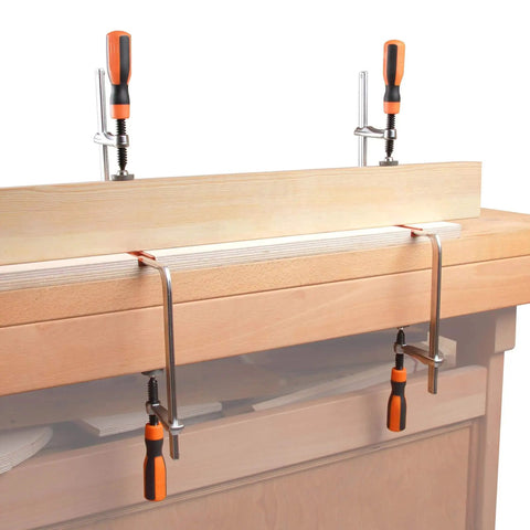 Track F Clamp For 3/8 x 3/4 Double Cut T-Track, 6 Inch Opening, 2 3/8 Inch Throat installed on a woodworking bench