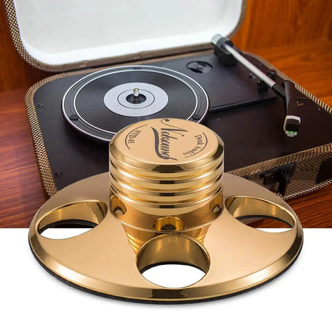 LP Vinyl Turntable Stabilizer Disc Weight For Reducing Resonance And Noise Floor in gold finish with turntable background.