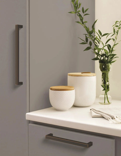Monument Oil Rubbed Bronze Cabinet Pull 3-3/4 Inch Center-to-Center 4-1/8 Inch Overall Length installed on kitchen drawer