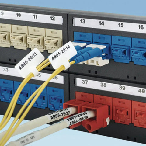 Network panel with connected cables and visible RJ45 Jack Blockout Device Kit With 10 Black Blockouts And Removal Tool in use