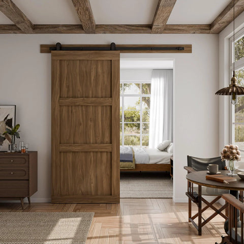 Six Foot Sliding Barn Door Hardware Kit Heavy Duty Silent Operation With Nylon Wheels And Spring Damping No Nonsense Easy To Install Fits Thirty Six Inch Wide Single Door Panel Black T Shaped Style Supports Up To 330 Lb installed on wooden door in living room