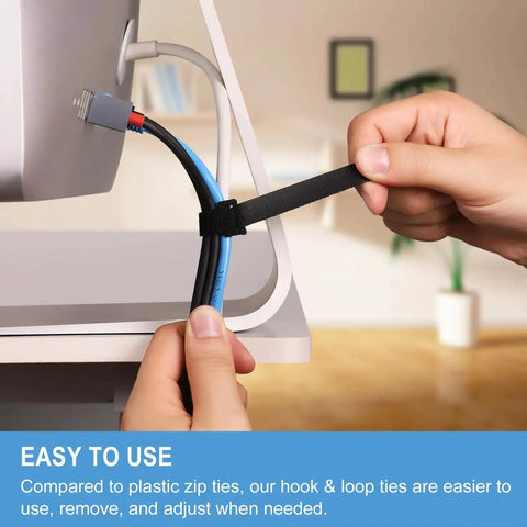 Person adjusting an Eight Inch Reusable Cable Ties With Hook And Loop Wraps for cord management at desk setup.