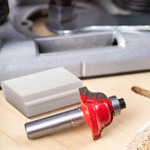 Two Pack Pro Grade 45 Degree Lock Miter Router Bit Setup Jigs For One Half Inch And Three Quarters Inch Stock With Three Quarters Inch And Five Eighths Inch Cutting Height Crown Molding Jig For Miter Saw, showing a red lock miter router bit and HDPE jig on wood surface.