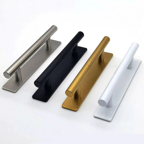 Four stainless steel and colored adhesive door handles in black, silver, gold, and white side by side on a white background.