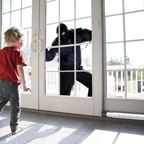 Two Pack Adjustable Sliding Door And Window Security Bar 18 To 51 Inches Extendable Inside Mount White For Sliding Doors And Windows Two In One Security Rod Enhances Home Security And Prevents Breakins, showing a security bar installed on a sliding door preventing unauthorized entry.