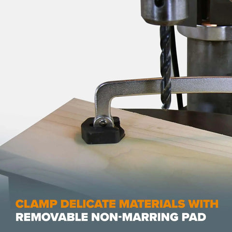 Auto Adjust 6 Inch Drill Press Clamp For Woodworking And Metalworking holding wood piece with drill press, non-marring pad visible.