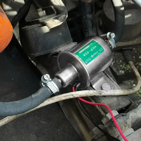 12V Inline Fuel Pump Universal Low Pressure 3-6 PSI, 30 GPH, 8mm Hose, Copper Clad Aluminum installed in engine bay.