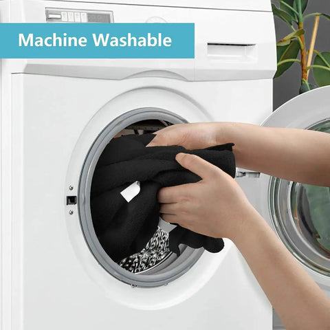 Person placing Premium Microfiber Cleaning Cloths 150 Pack 11.5 By 11.5 Inches into washing machine