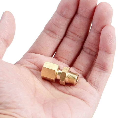 Person holding a single brass male straight coupler from the Heavy Duty Brass Tube Fitting Set Four Pack For Plumbing Pros One Quarter Inch Tube OD