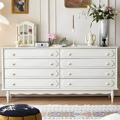 Dresser featuring Six Pack White Dresser Knobs Set Featuring Pearl Clover Design With Gold Finish in a bright room.