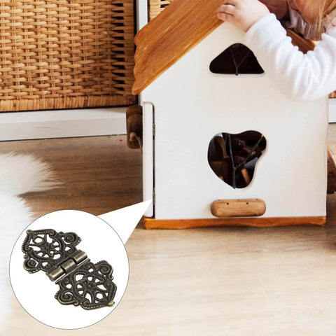 Butterfly Hinges 10 Pack Zinc Alloy for Wooden Boxes and Small Cabinets used on a miniature toy house door, showing detailed design.