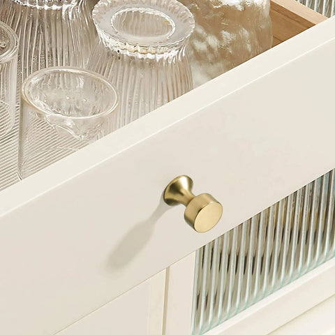 Close-up of Champagne Bronze Cabinet Knobs 10 Pack Modern Drawer Pulls on white kitchen cabinet drawer with glassware
