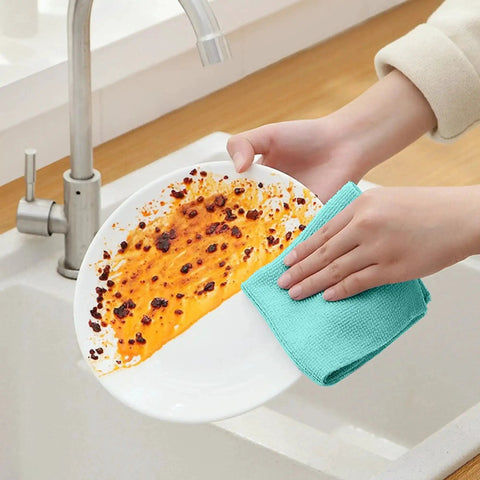 Person cleaning a stained plate with Ultra Soft Microfiber Cleaning Cloths 8 By 8 Inches 40 Pack Lint Free Rags Blue Color