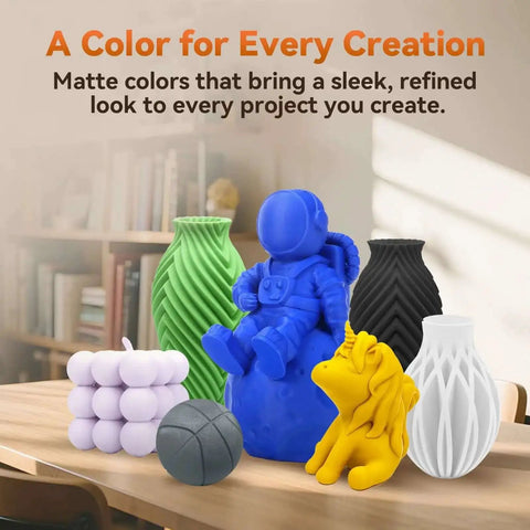 Colorful 3D printed objects on a table showcasing use of Matte White PLA Filament 1.75mm 1kg Spool For 3D Printing, Easy To Use On Most FDM Printers