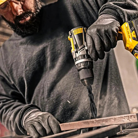 Worker using Pro Grade Workhorse Multi Material Drill Bit Set Meccion One Eighth Inch By Three Point Six Inch Cross Tip Tungsten Carbide