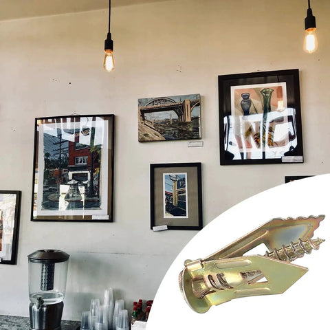 50 Pcs Self Drilling Drywall Anchors And Screws Kit Zinc Plated Steel Wall Anchors With Self Tapping Screws in front of framed artwork.