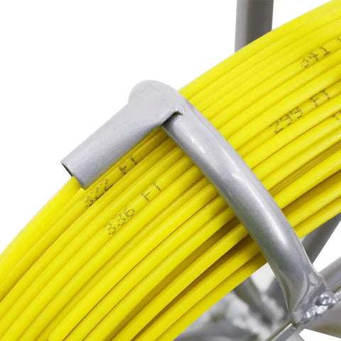 Close-up of gray hook on yellow fiberglass rod of 6mm diameter on a steel reel, part of Fiberglass Duct Rod Fish Tape Puller Kit with 450 feet.
