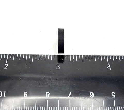 Half Inch Wide Round Silicone Rubber Bumper Feet Pads One Eighth Inch Thick With Adhesive Backing beside ruler for size reference.