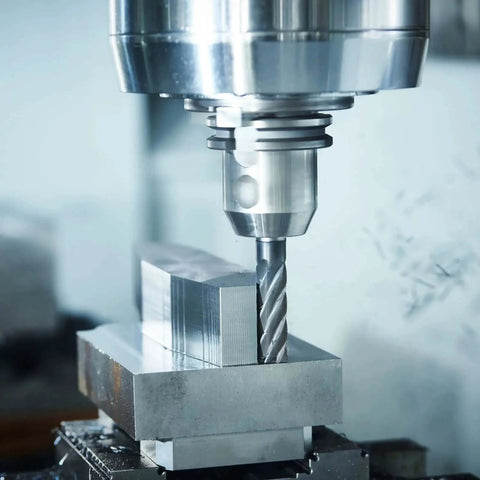 Four Piece HSS AL End Mills Set Pro Grade With Three Eighths Inch Cutting Diameter And Three Eighths Inch Shank Four Flutes Upcut Spiral Milling Cutter For Wood PVC MDF Engraving Router Bits in use on a milling machine.