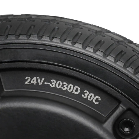 Close-up of a 6.5-inch road tire on a wheel, black rubber with tread and 24V-3030D 30C on the sidewall.