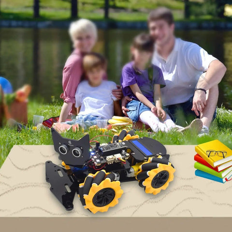 4WD Omni Directional Robot Kit With Mecanum Wheels on table, blurred family in background, featuring LCD1602 and sensors