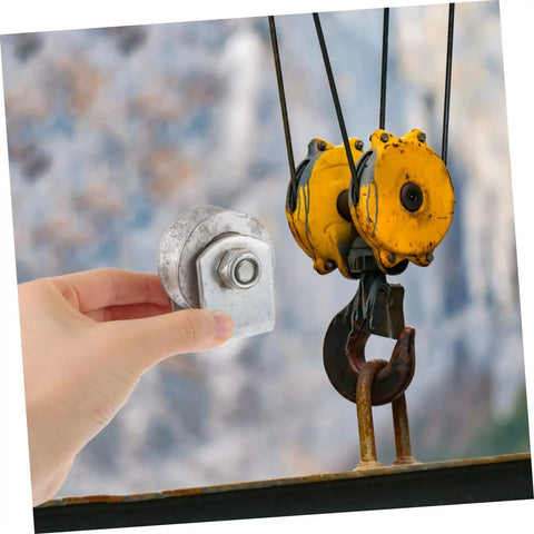 Person holding Heavy Duty Cast Iron V Groove Wheel For Garage Doors And Sliding Gates with yellow pulley in background