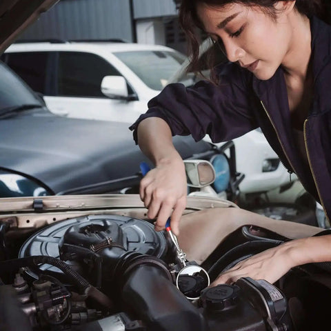 Mechanic using Four Piece Telescoping Magnetic Pick Up Tool Kit With Flexible Grabber A Real Workhorse For Reaching Under Cars Two Magnetic Pick Up Tools 2 Lb And 16 Lb And Four Claw Grabbers Plus Telescoping Inspection Mirror For Auto Repair And Car Maintenance to inspect car engine.