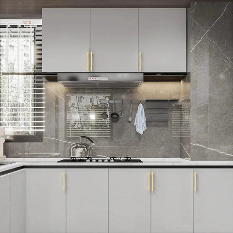 Modern kitchen with 10 Pack 5 Inch Brushed Gold Cabinet Handles For Kitchen Cabinets And Drawers installed on grey cabinets.